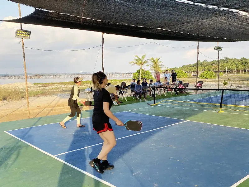 Booking the Pickleball Package for a unique sports holiday experience at Batam resort with beach.